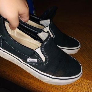 Black and white slip on Vans